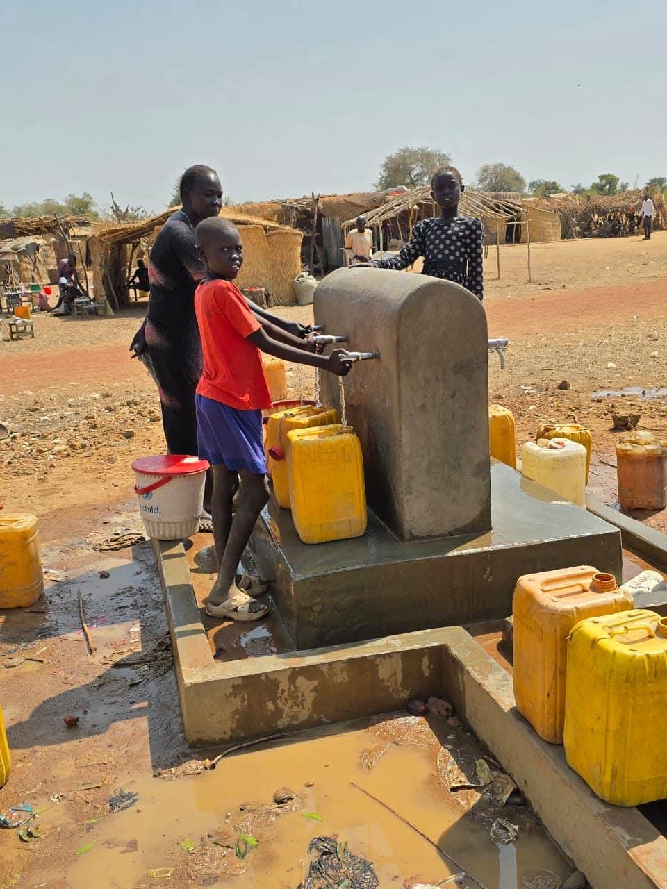Collecting water at a new tap stand