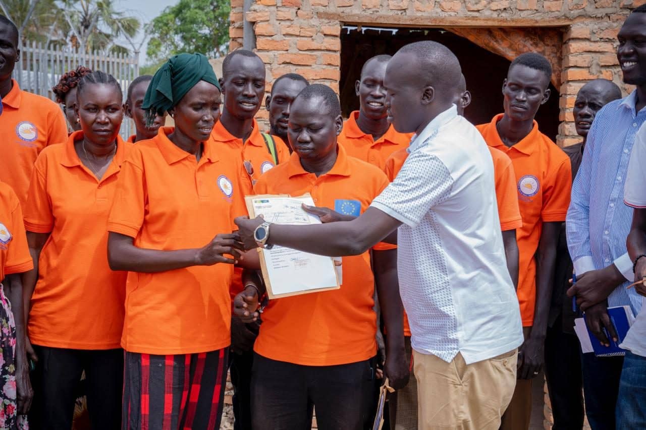 Young people receiving training certificates
