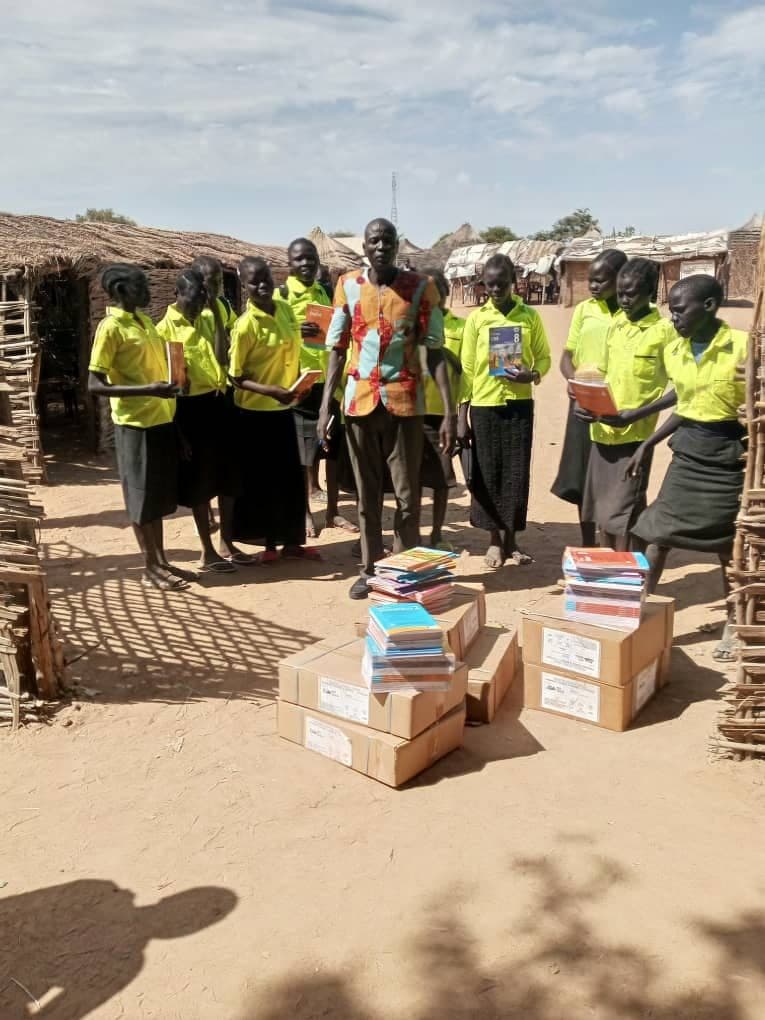 Volunteers distributing books